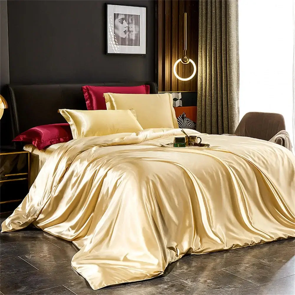 Glossy gold satin duvet cover set with matching cream and burgundy pillows from the decorbites™ pcs duvet cover collection