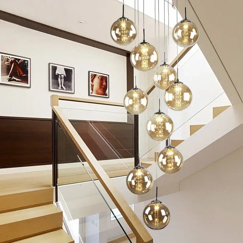 DecorBites Luxurious spiral LED chandelier with amber glass globes and filament lighting for modern loft spaces and hotels