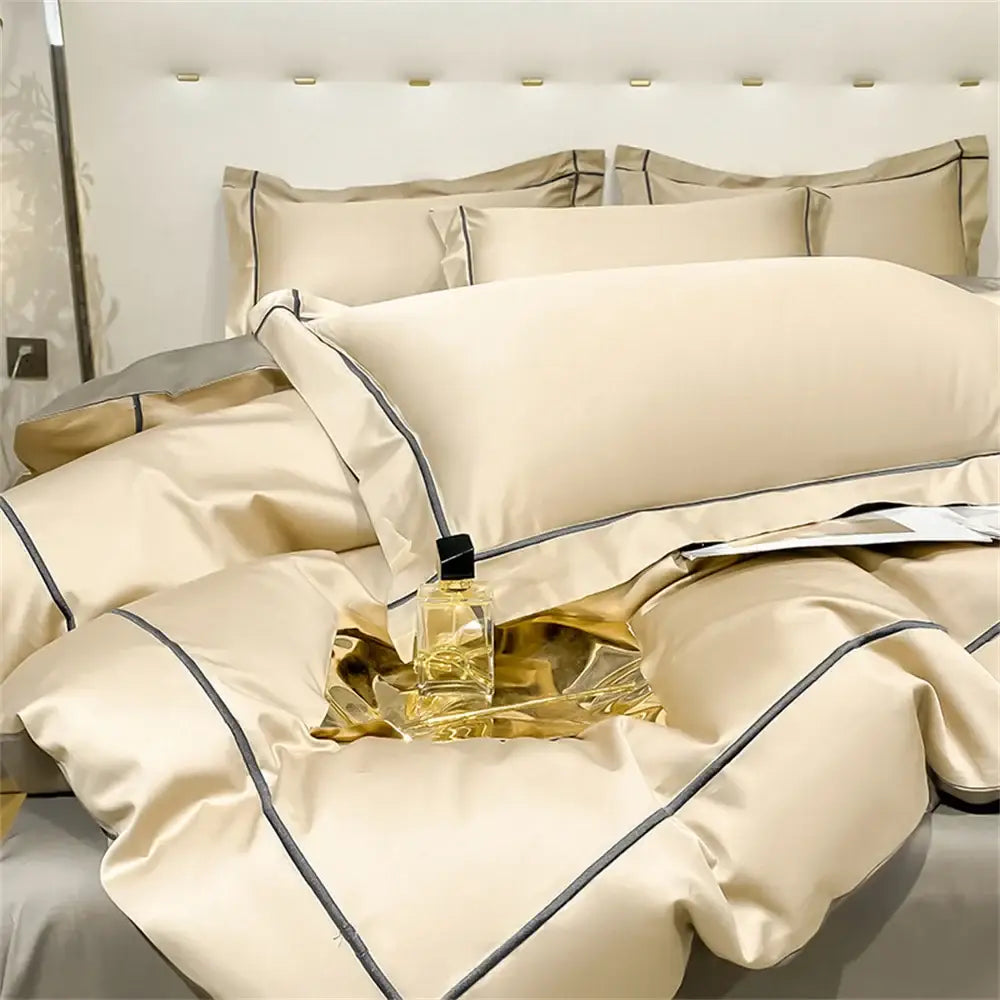 Cream-colored satin egyptian cotton bedding set with elegant black piping accents from DecorBites Luxurious Svetanya collection