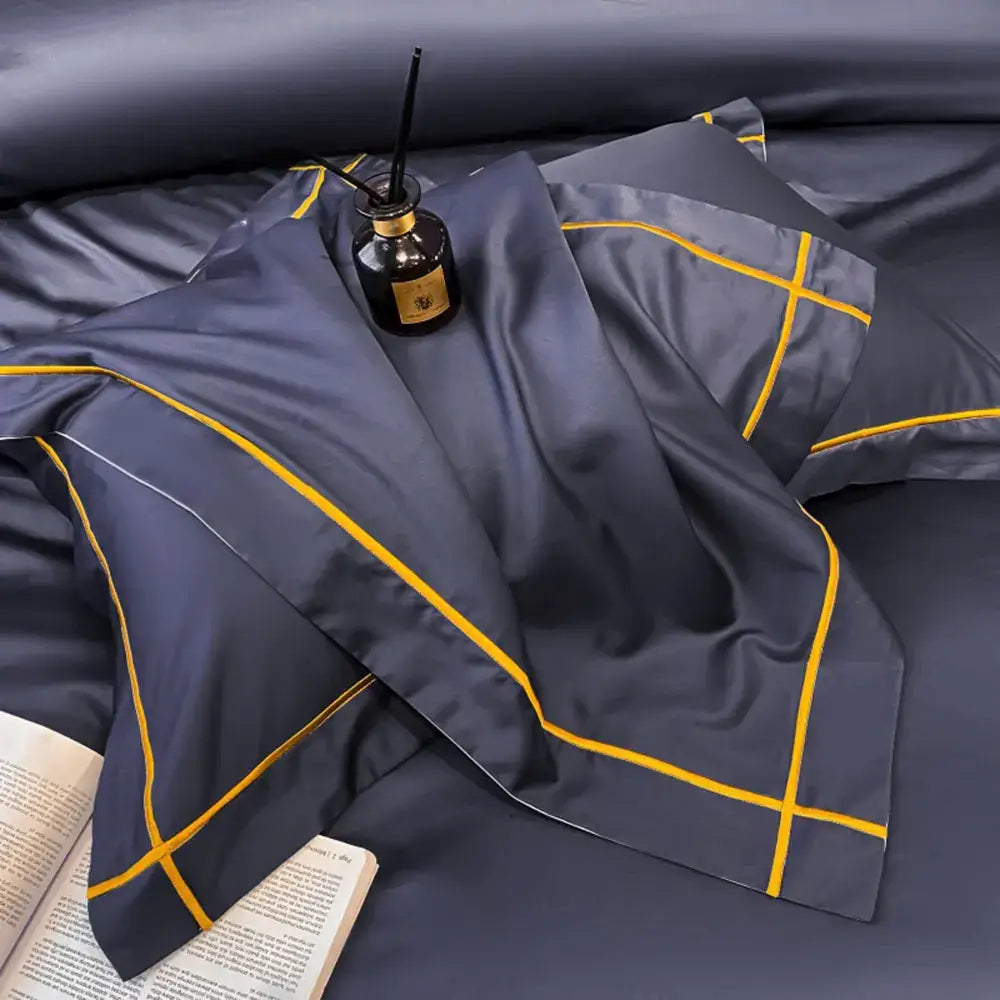 Dark blue satin pillowcase with bold yellow geometric stitching from decorbites egyptian cotton bedding set