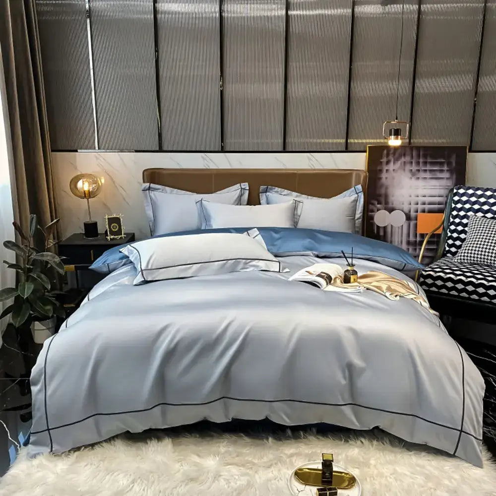 Light blue satin duvet cover bedding set with black piping trim made of luxurious egyptian cotton by decorbites