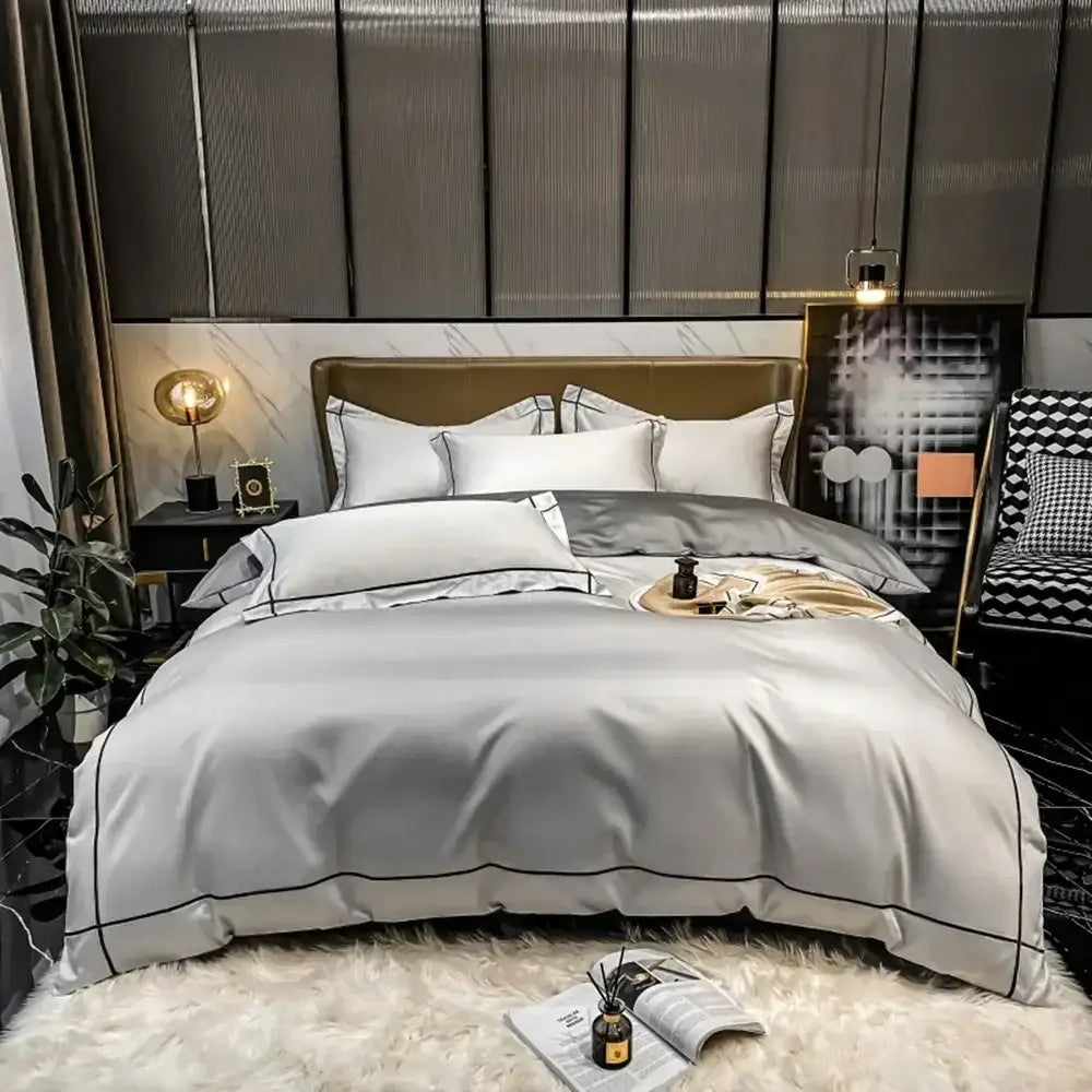 Silver satin duvet cover bedding set with black piping trim made from luxurious Egyptian cotton by DecorBites