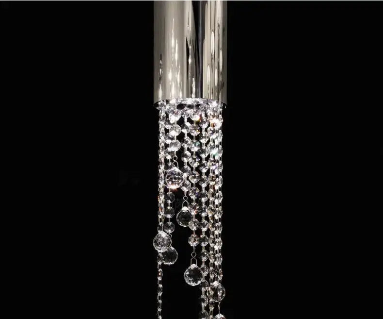 A luxury chrome crystal led chandelier with cascading clear faceted beads for staircase illumination