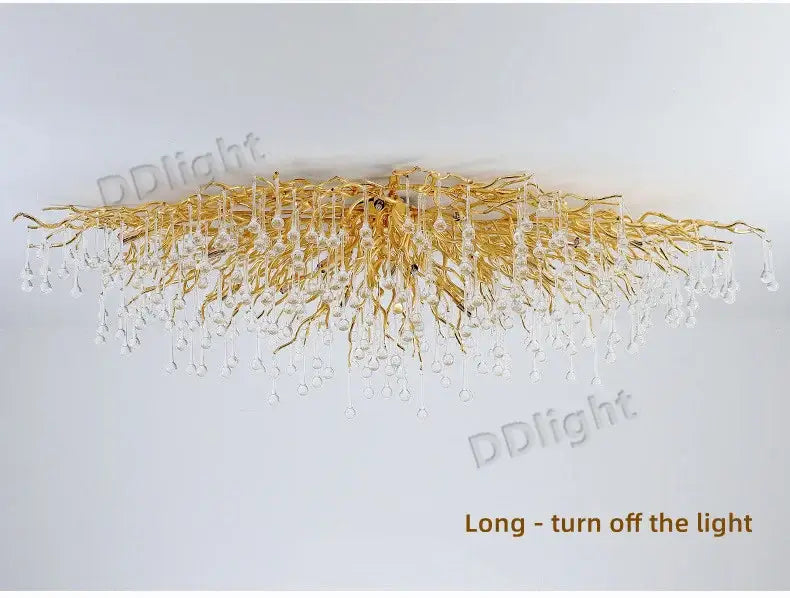 DecorBites luxury crystal chandelier with gold-toned branch-like arms and clear crystal droplets for elegant home decor