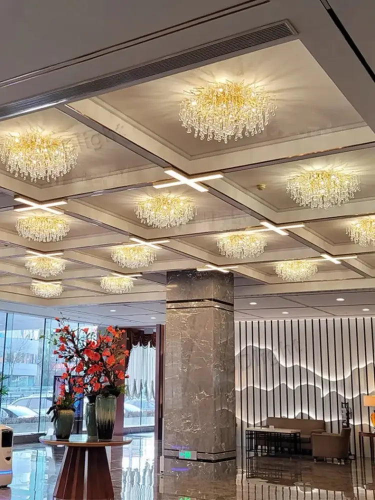 Golden luxury crystal chandelier with cascading glass droplets for elegant home decor by decorbites™