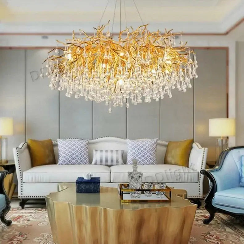 DecorBites™ luxury crystal chandelier featuring a golden branch-style design with dangling crystal droplets for home decor