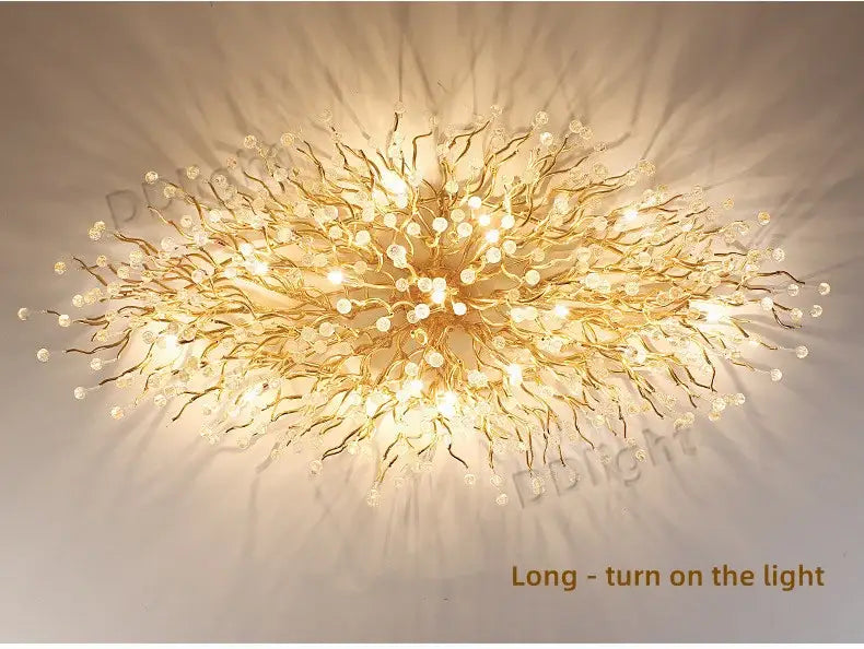 Golden branch-style ceiling light luxury crystal chandelier with clear crystal accents for elegant home decor by DecorBites