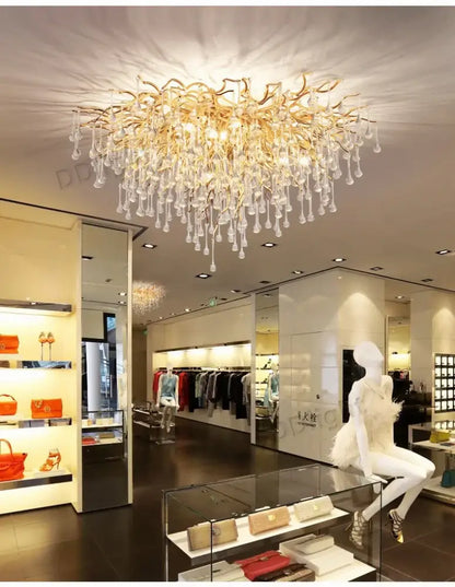 Golden luxury crystal chandelier with cascading crystal droplets from DecorBites™ for elegant home decor