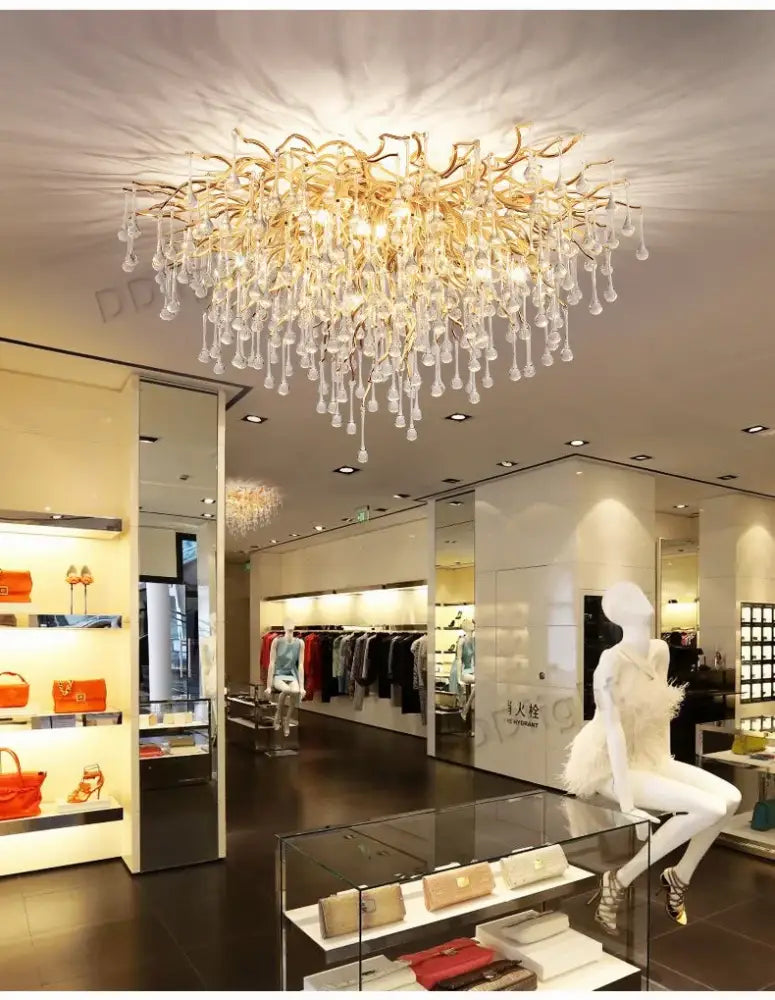 Golden luxury crystal chandelier with cascading crystal droplets from DecorBites™ for elegant home decor