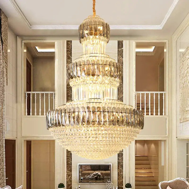 A decorbites luxury crystal chandelier in gold with multi-tiered cascading faceted glass for dining rooms
