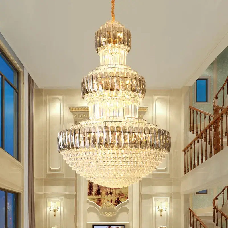 Decorbites luxury crystal multi tiered chandelier with a golden finish and cascading glass elements for dining room