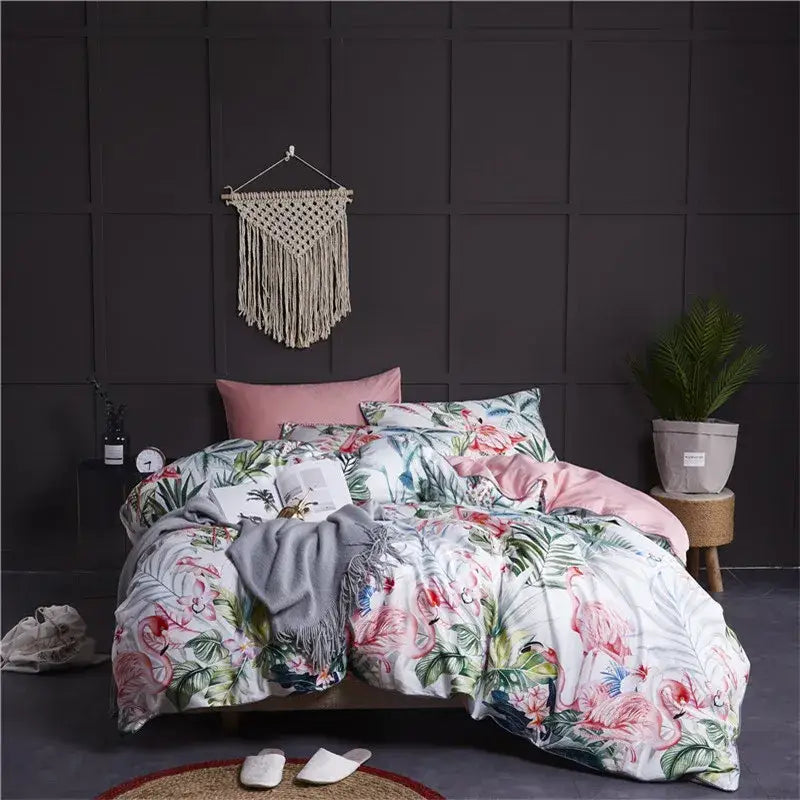 Floral-patterned duvet cover and pillowcases with pink flamingos and tropical leaves in luxury egyptian cotton