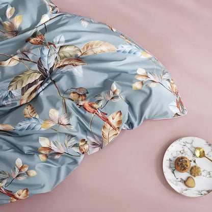 Decorbites luxury egyptian cotton duvet cover in light blue satin with tropical leaf print and vibrant red parrot design