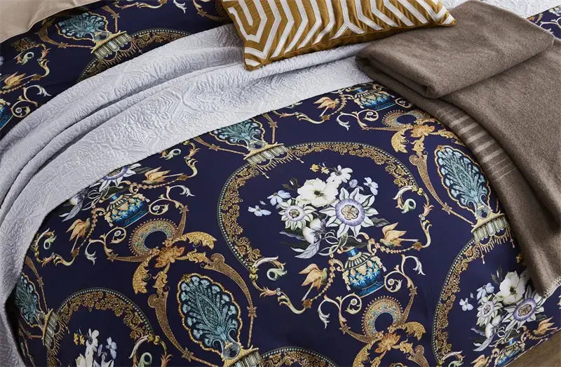 The navy blue duvet cover with gold and teal baroque floral motifs is part of DecorBites™ egyptian cotton bedding set