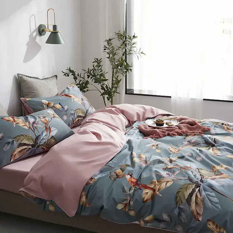 Blue floral duvet cover set with pink satin-like lining and matching pillowcases in luxury egyptian cotton by decorbites