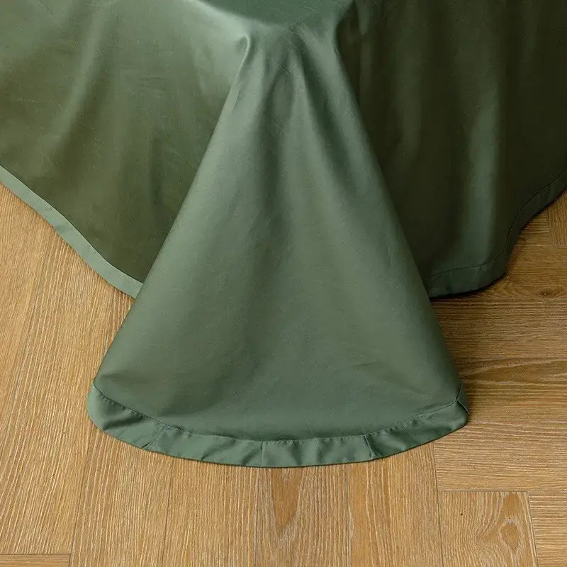 Olive green satin tablecloth with subtle sheen and finished hem complementing egyptian cotton duvet cover pieces pillowcases
