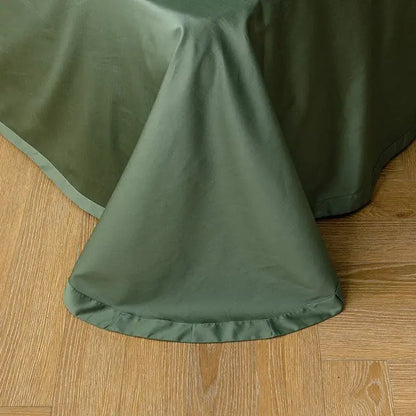 Olive green satin tablecloth with subtle sheen and finished hem complementing egyptian cotton duvet cover pieces pillowcases