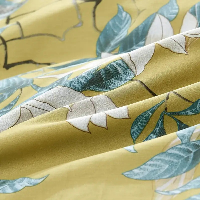 Yellow fabric duvet cover with teal and white leaf pattern in egyptian cotton luxury bedding set decorbites pieces pillowcases