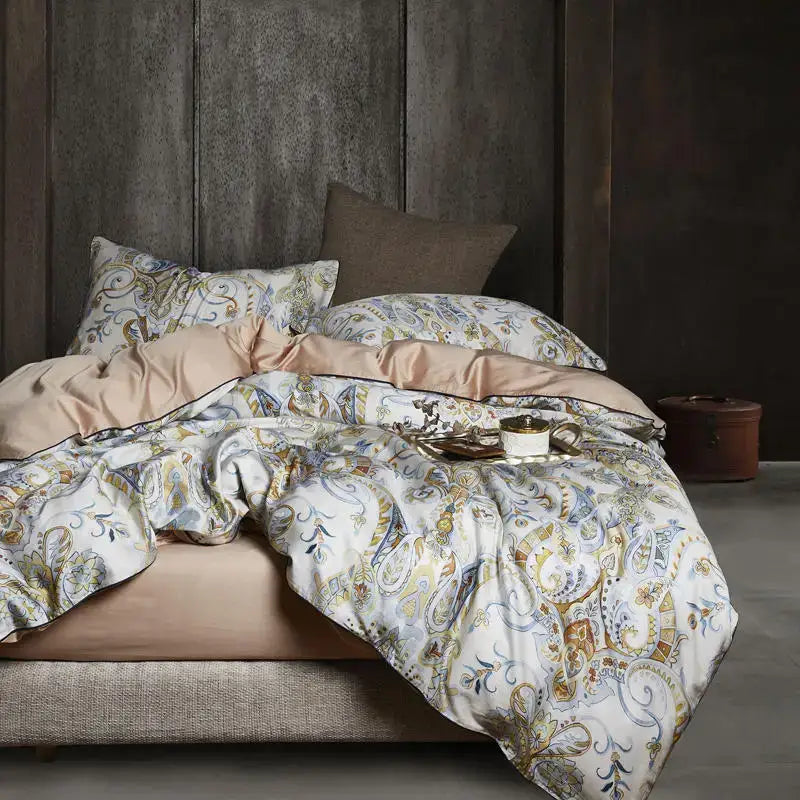 Luxurious cream-colored duvet cover with gold and blue paisley pattern and satin lining in egyptian cotton bedding set