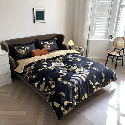 Elegant navy blue duvet cover and matching pillowcases with gold leaf pattern and tan lining in egyptian cotton by DecorBites