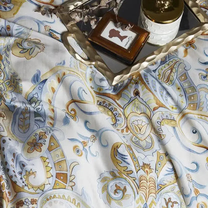 Decorbites luxury egyptian cotton duvet cover and pillowcases with intricate gold blue and beige paisley pattern on white fabric