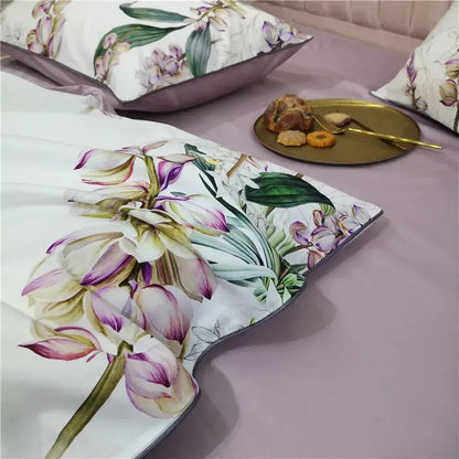 A white egyptian cotton pillow sham with purple and green orchid print from decorbites luxury bedding set