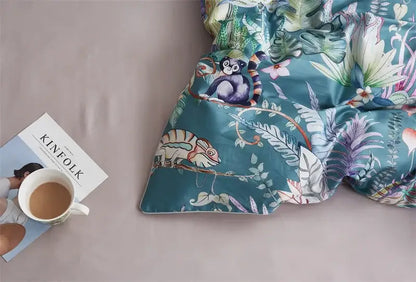 Teal-colored duvet cover with vibrant jungle print featuring monkeys and chameleons in egyptian cotton decorbites bedding set