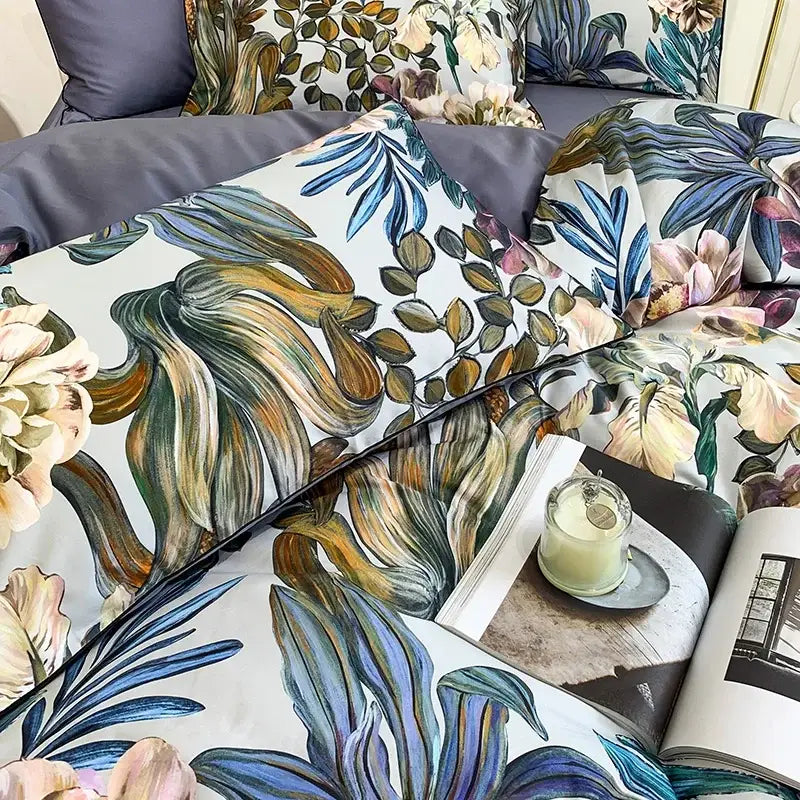 Botanical-patterned duvet cover and pillowcases in soft blue green beige tones made of luxury Egyptian cotton