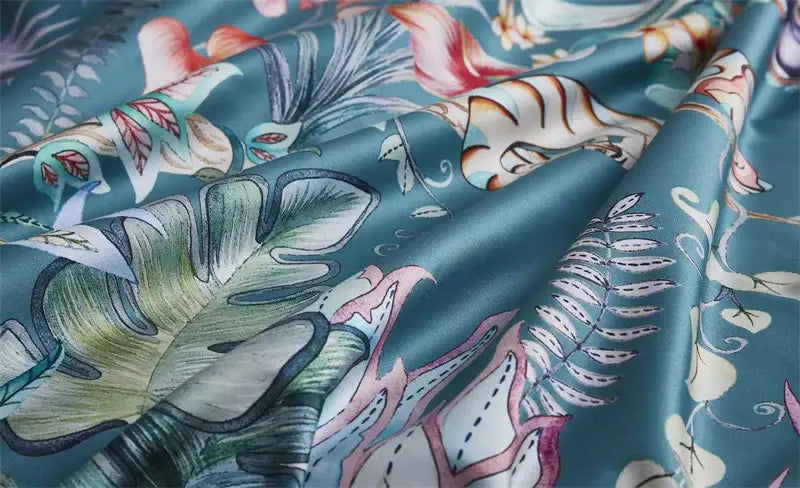 Teal satin duvet cover and pieces pillowcases with vibrant flamingo leaf pattern in luxury egyptian cotton bedding set
