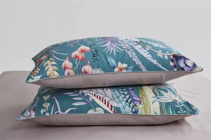 Teal floral-patterned pillow from DecorBites luxury egyptian cotton bedding set with subtle stitching details