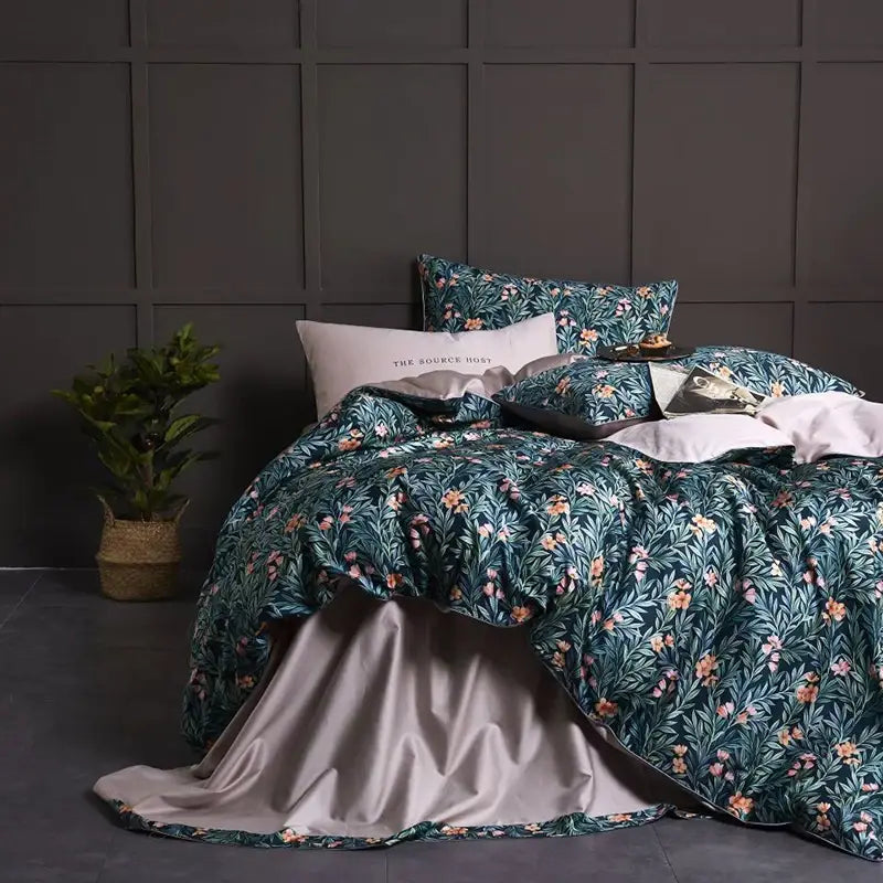 Teal floral duvet cover set with pink and orange blossoms satin-lined interior made of egyptian cotton includes pillowcases