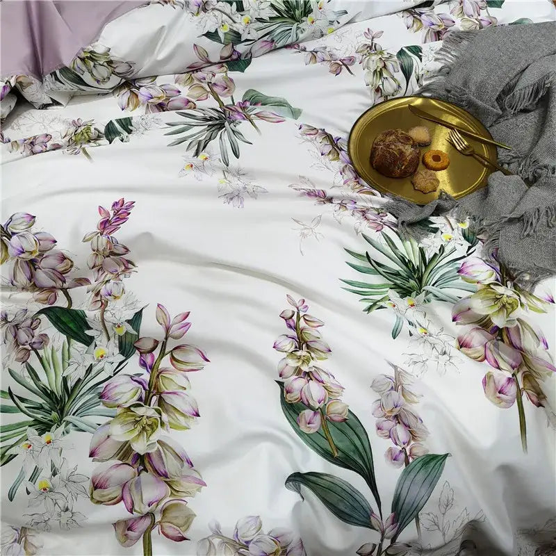 White duvet cover with purple and green orchid botanical print on soft satin-like egyptian cotton fabric pieces pillowcases