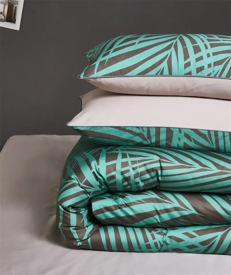 DecorBites luxury egyptian cotton duvet cover set with teal and dark gray tropical leaf pillowcases on satin fabric