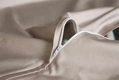 Beige satin fabric with subtle sheen and white zipper closure on decorbites luxury egyptian cotton duvet cover piece