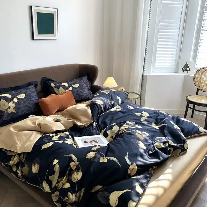 Navy blue satin duvet cover and matching pieces pillowcases with gold leaf pattern from DecorBites™ luxury bedding set
