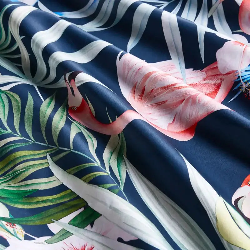 DecorBites™ luxury Egyptian cotton duvet cover and pillowcases with vibrant pink flamingo tropical print on navy background