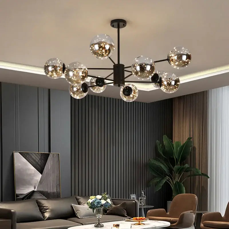 Modern black metal chandelier with multiple clear glass ball bulbs providing warm light and remote control dimming