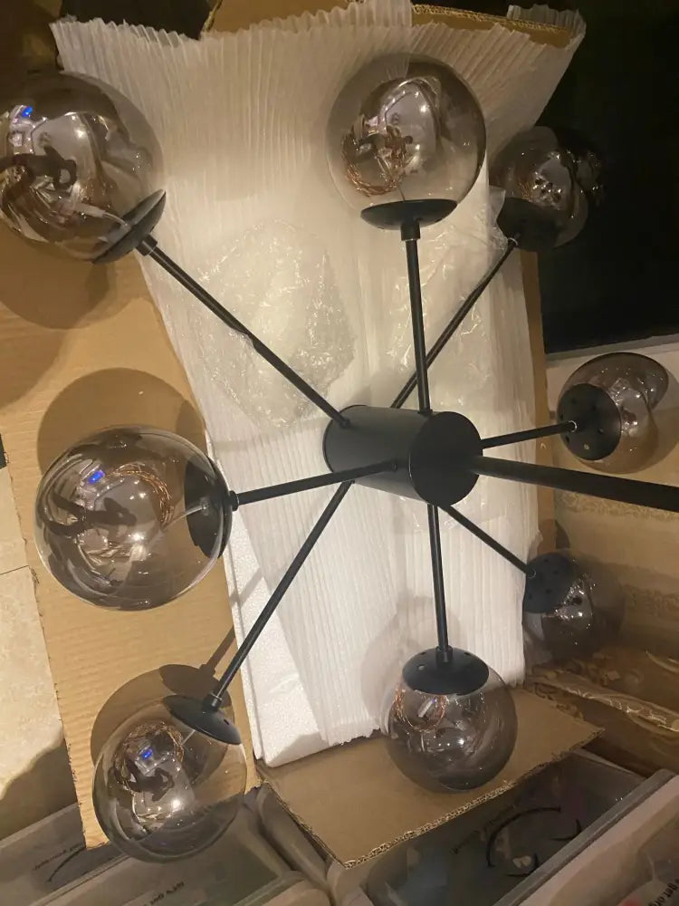 Modern black metal DecorBites luxury glass ball chandelier with eight reflective globes and dimmable warm light remote control