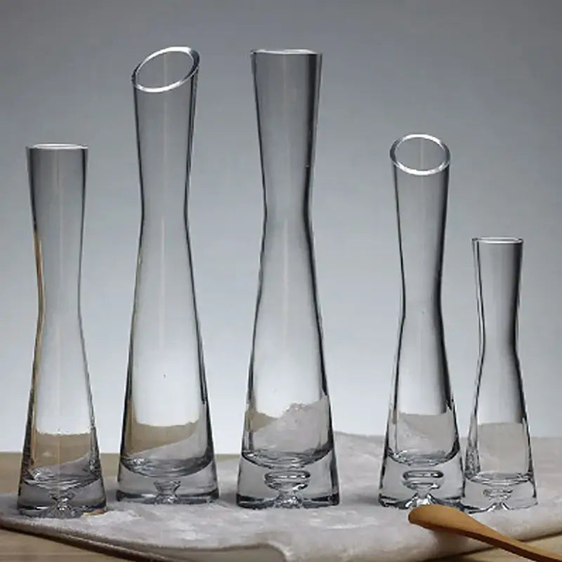 Set of five clear DecorBites™ luxury glass flower vases with slender necks and flared bases for home decor