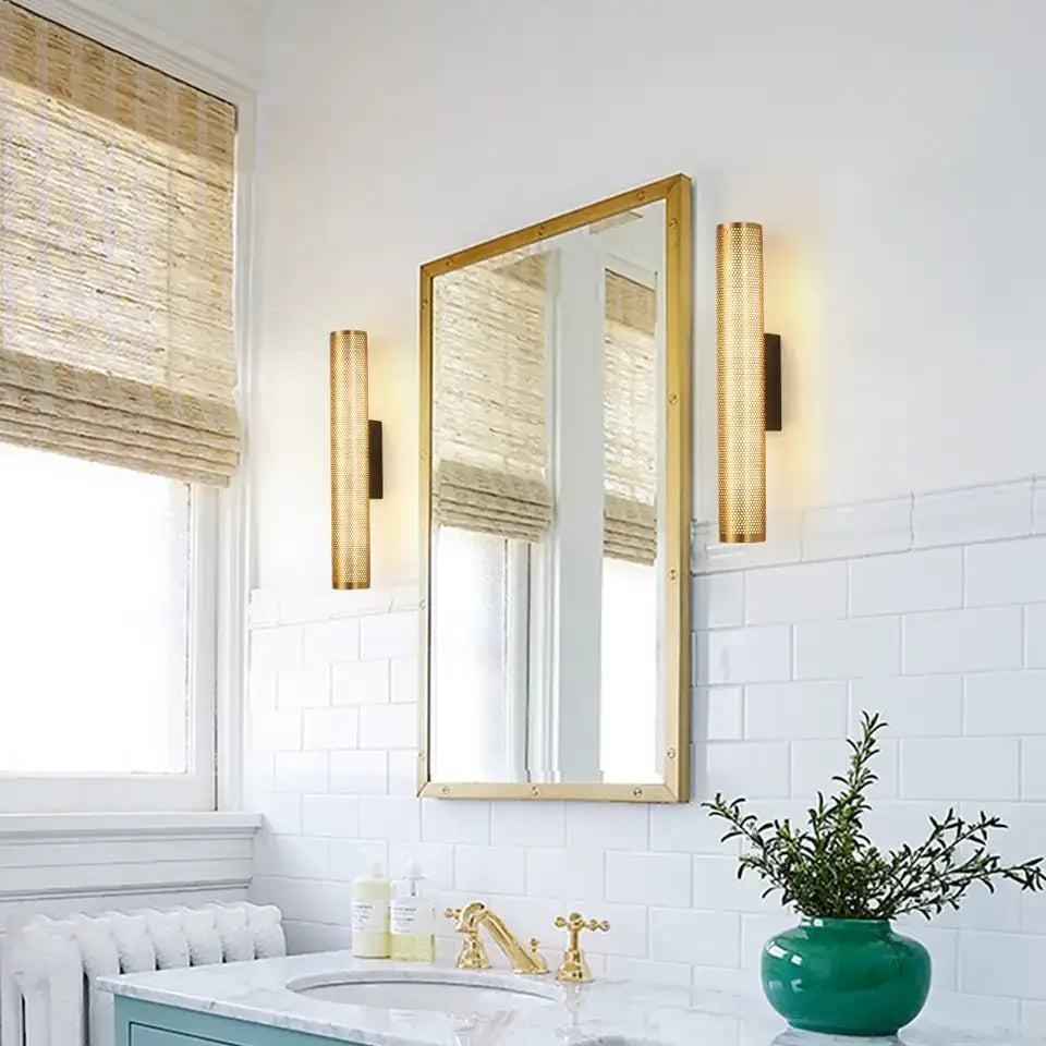 Gold-framed rectangular mirror with sleek modern design complementing a decorbites luxury gold wall sconce with gold finish