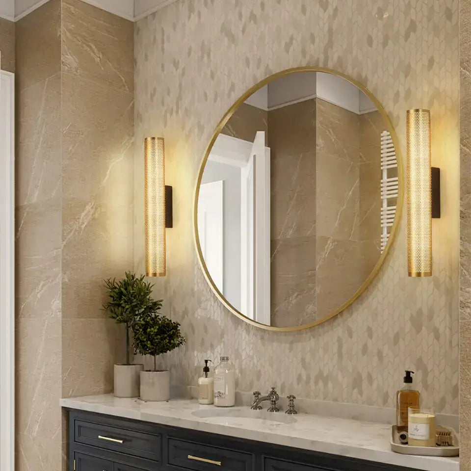 Gold-framed round mirror wall sconce with sleek modern design and luxury gold finish for elegant vanity decor