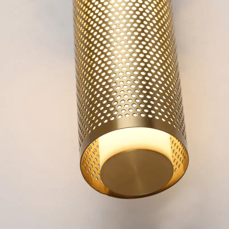 Decorbites™ luxury gold vanity wall sconce with gold finish perforated metal cylindrical design and warm diffused light