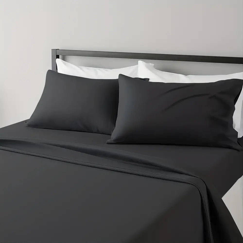 Black satin-like luxury bed sheet set by DecorBites with a smooth glossy finish ideal for hotel luxury use