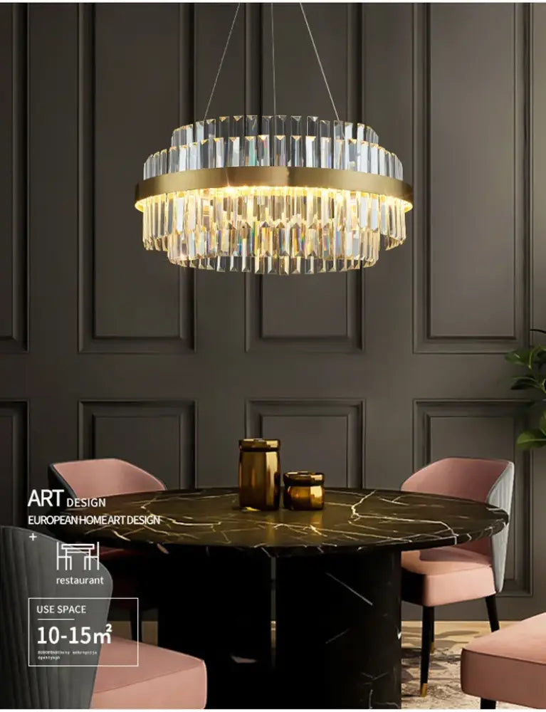 Gold-toned decorbites™ luxury led crystal chandelier with cascading prisms above dark marble dining table