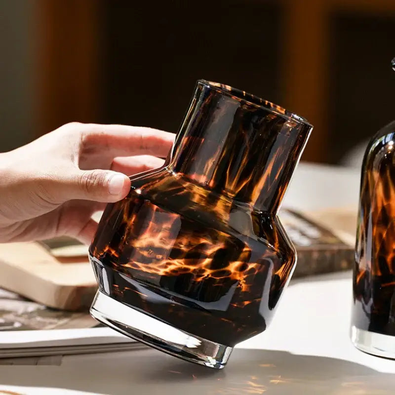 DecorBites™ luxury leopard glass vase with sleek amber-tortoiseshell geometric design and clear base for home decor