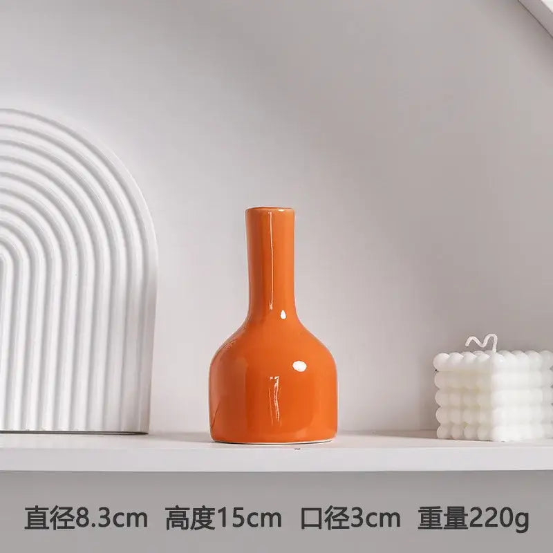 DecorBites luxury modern ceramic vase in glossy orange with a slender neck and rounded body for elegant decor
