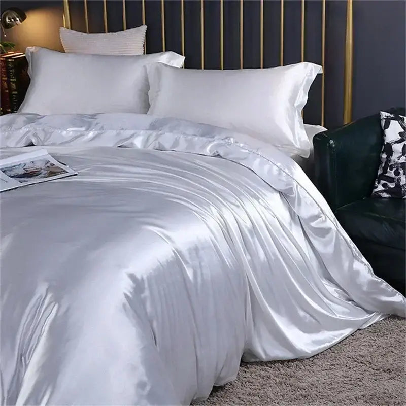 Silver satin duvet cover with smooth glossy finish and elegant folds in DecorBites luxury natural mulberry silk bedding set