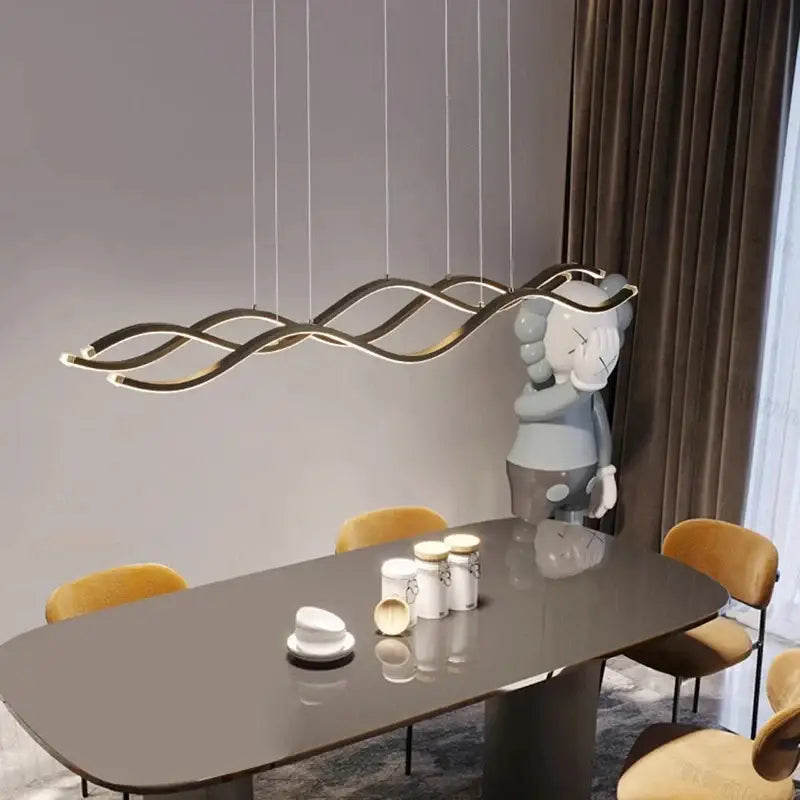 Modern gold-toned wave-shaped led pendant light with sleek curves for dining room luxury nordic chandeliers by decorbites