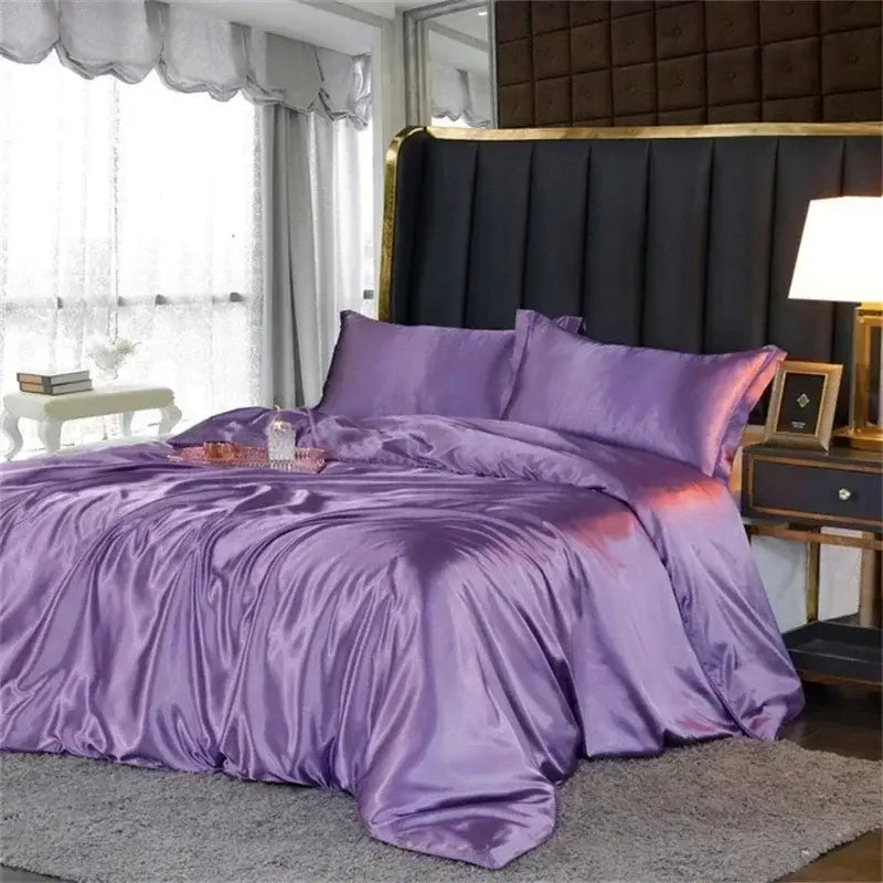 DecorBites™ luxury silk bedding set with lustrous purple satin duvet cover and fitted sheet with elegant draping