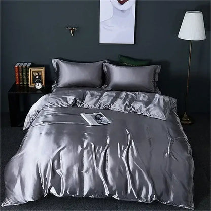 Decorbites luxury silk bedding set in silver satin featuring a duvet cover and fitted sheet with a smooth glossy texture